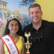 Traverse City pageant contestant Olympia Poses with dentist Brian Klym In Michigan