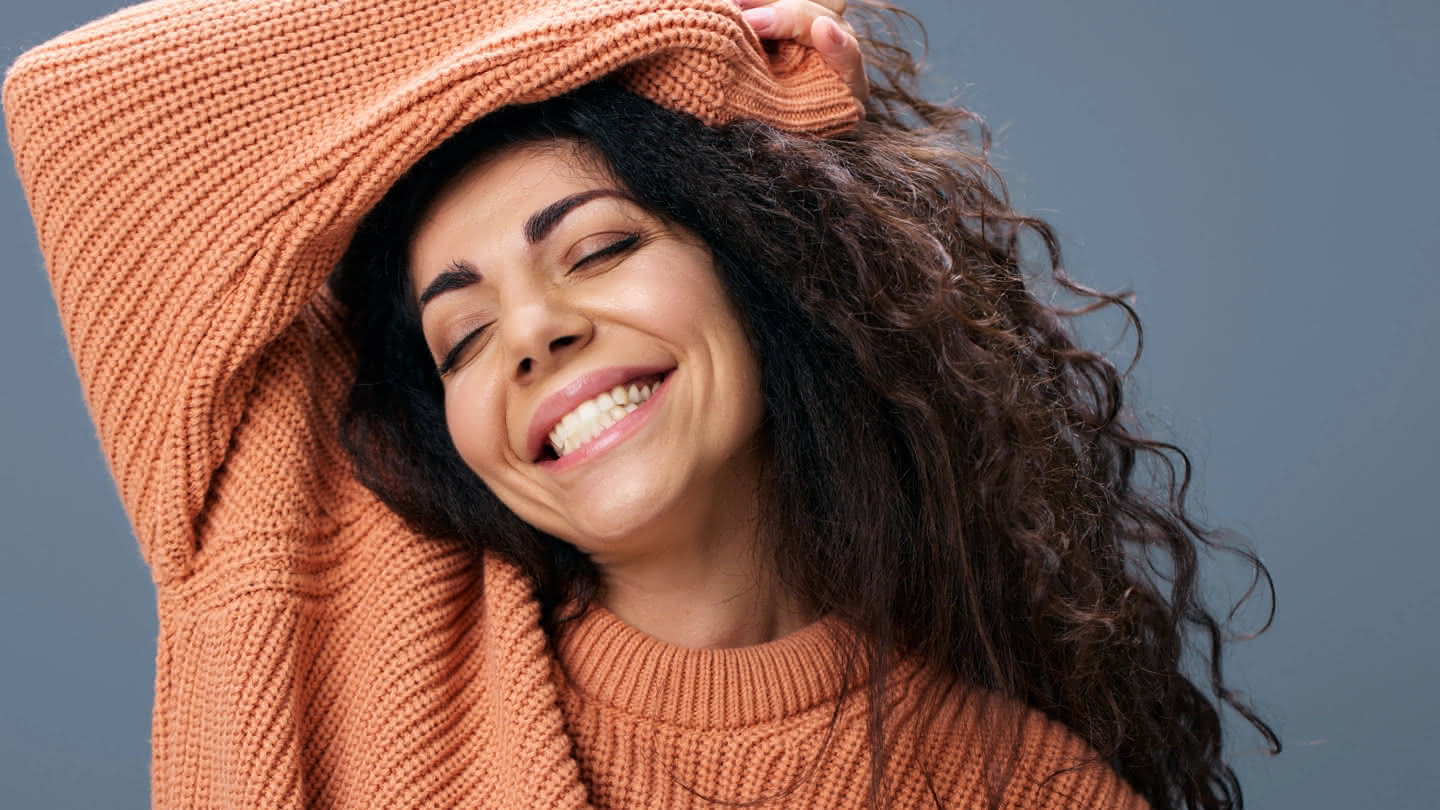 A woman smiling